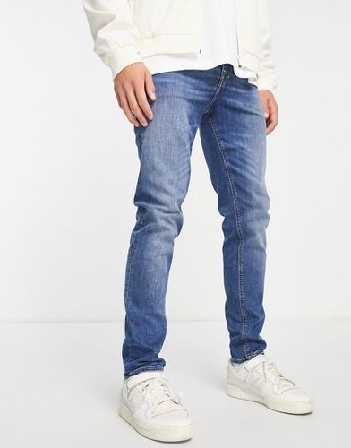 Jeans skinny lavaggio medio - ASOS DESIGN - Modalova