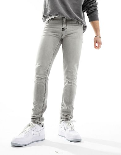 Jeans skinny lavaggio grigio - ASOS DESIGN - Modalova