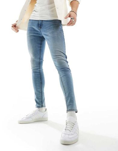 Jeans spray on power stretch lavaggio tinto - ASOS DESIGN - Modalova