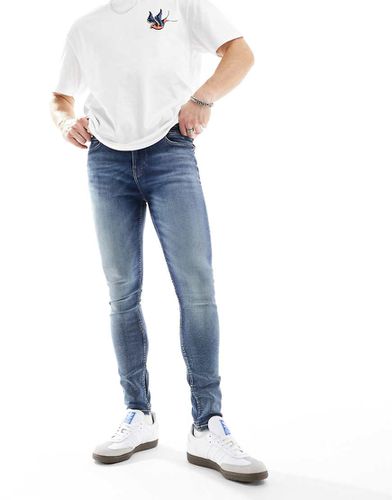 Jeans spray power stretch lavaggio scuro - ASOS DESIGN - Modalova