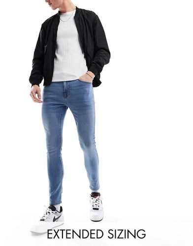 Jeans spray power stretch lavaggio scuro - ASOS DESIGN - Modalova