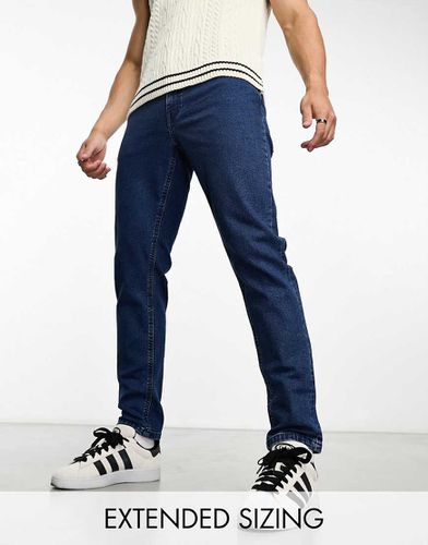 Jeans stretch affusolati lavaggio medio rétro - ASOS DESIGN - Modalova