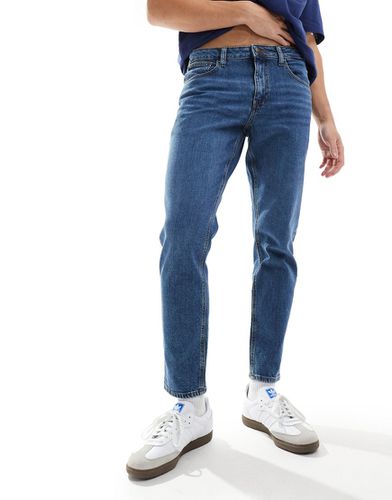 Jeans stretch affusolati lavaggio scuro - ASOS DESIGN - Modalova
