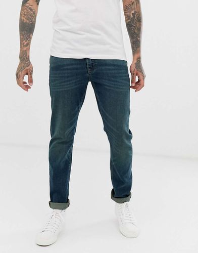 Jeans stretch slim lavaggio vintage scuro - ASOS DESIGN - Modalova