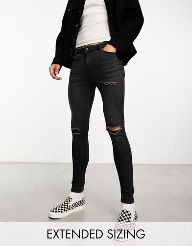 Jeans super skinny ed elasticizzati slavato con strappi - ASOS DESIGN - Modalova