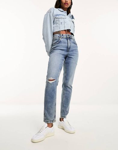 Mom jeans confortevoli slim medio con strappi - ASOS DESIGN - Modalova