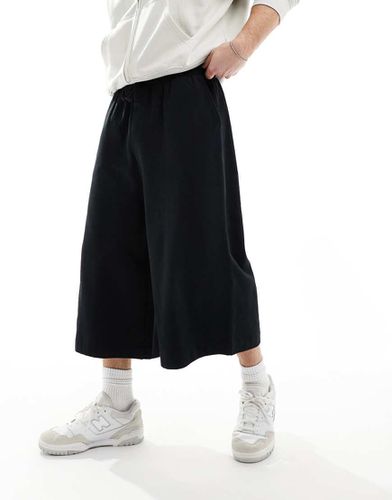 Pantaloncini neri taglio super lungo - ASOS DESIGN - Modalova