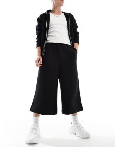 Pantaloncini neri taglio super lungo - ASOS DESIGN - Modalova