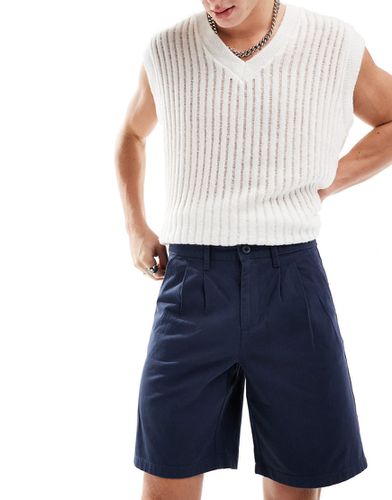 Pantaloncini chino con doppia piega taglio lungo - ASOS DESIGN - Modalova