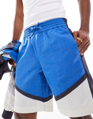 Pantaloncini ampi in nylon con pannelli a contrasto in coordinato - ASOS DESIGN - Modalova