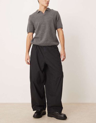 Pantaloni oversize con gamba a palloncino neri con anello a D - ASOS DESIGN - Modalova