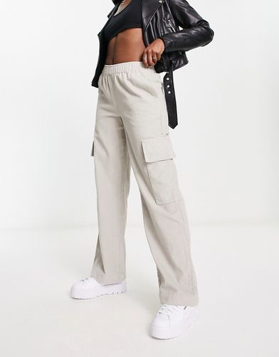 Pantaloni a fondo ampio in velluto a coste color pietra con tasche applicate - ASOS DESIGN - Modalova