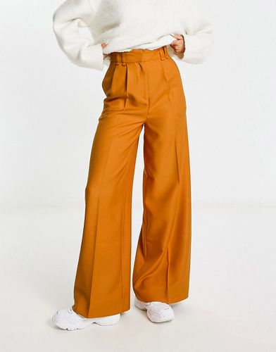 Pantaloni a vita alta con fondo ampio arancioni - ASOS DESIGN - Modalova