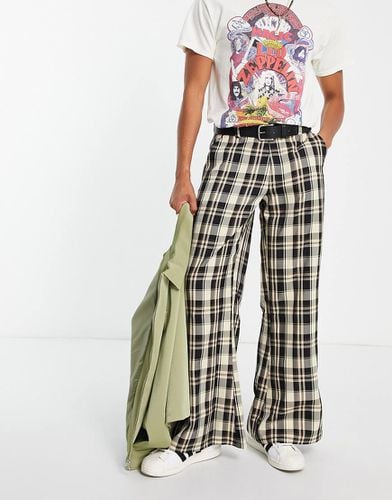 Pantaloni a zampa ampi a quadri - ASOS DESIGN - Modalova