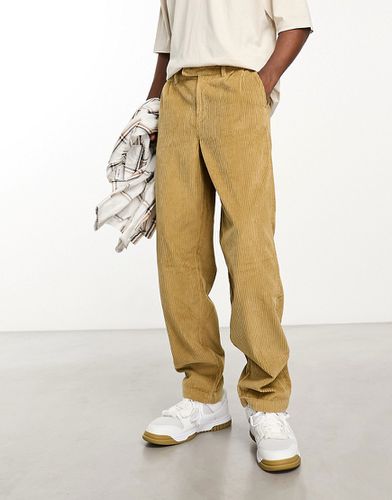 Pantaloni ampi in velluto a coste color pietra - ASOS DESIGN - Modalova