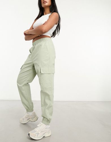Pantaloni cargo con fondo elasticizzato color salvia - ASOS DESIGN - Modalova