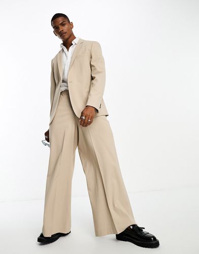 Pantaloni da abito a fondo molto ampio color pietra - ASOS DESIGN - Modalova