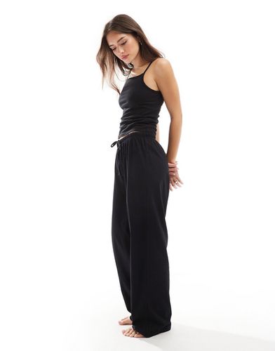 Pantaloni del pigiama mix & match neri in cotone - ASOS DESIGN - Modalova