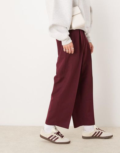 Pantaloni eleganti a palloncino bordeaux con pieghe sul davanti - ASOS DESIGN - Modalova