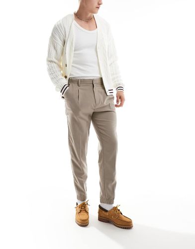 Pantaloni eleganti affusolati color pietra con fondo stile joggers - ASOS DESIGN - Modalova