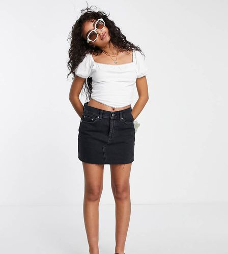 ASOS DESIGN Petite - Original - Minigonna di jeans a vita media slavato - ASOS Petite - Modalova