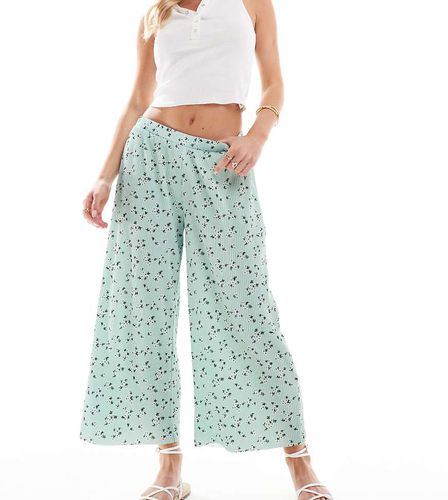 ASOS DESIGN Petite - Pantaloni culotte ampi plissé verdi a fiorellini - ASOS Petite - Modalova