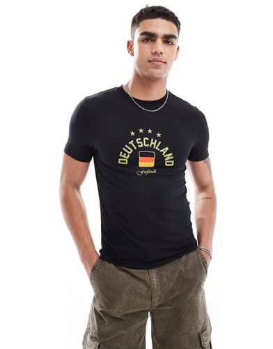 T-shirt attillata nera con stampa "Germany" sul petto - ASOS DESIGN - Modalova