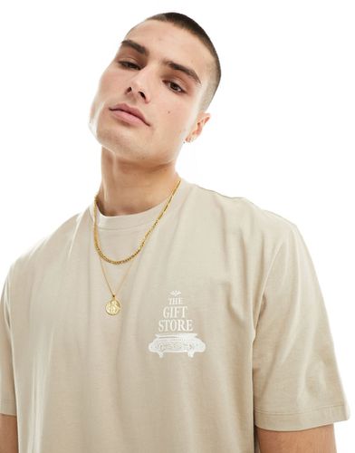 T-shirt comoda beige con stampa sul petto - ASOS DESIGN - Modalova