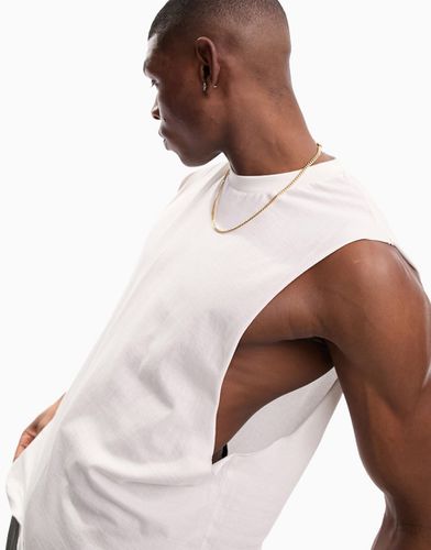 T-shirt comoda senza maniche con giromanica ampio bianca - ASOS DESIGN - Modalova