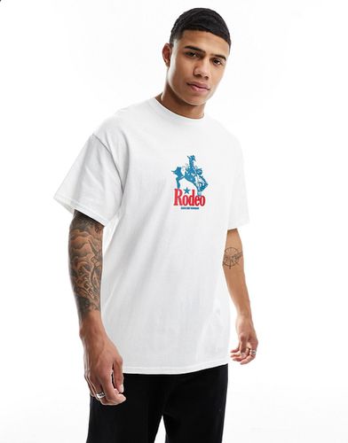 T-shirt oversize bianca con stampa di cowboy sul davanti - ASOS DESIGN - Modalova