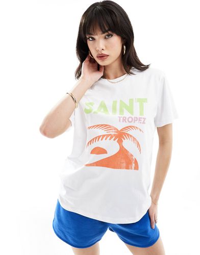 T-shirt regular fit bianca con stampa Saint Tropez su licenza - ASOS DESIGN - Modalova