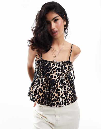 Top a canottiera in denim leopardato - ASOS DESIGN - Modalova