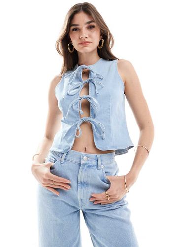 Top allacciato sul davanti in denim candeggiato - ASOS DESIGN - Modalova