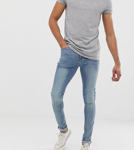 Tall - Jeans super skinny lavaggio chiaro - ASOS DESIGN - Modalova
