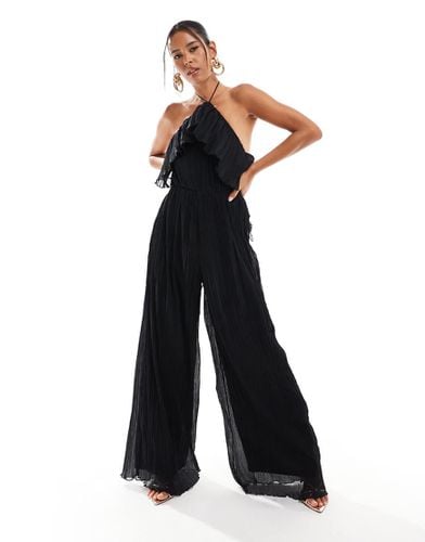 Tuta jumpsuit testurizzata nera allacciata al collo a fondo ampio con volant - ASOS DESIGN - Modalova