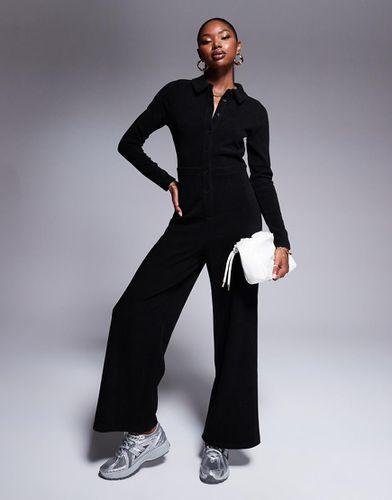 Tuta jumpsuit a maniche lunghe in tessuto a coste con bottoni - ASOS DESIGN - Modalova