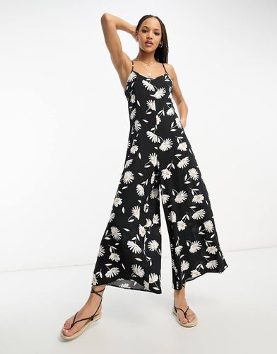 Tuta jumpsuit stile gonna pantalone con fascette sottili e stampa di margherite grandi - ASOS DESIGN - Modalova