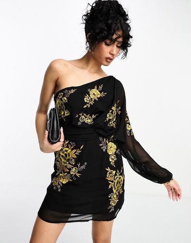 Vestito corto monospalla in chiffon nero con motivi floreali color calendula - ASOS DESIGN - Modalova