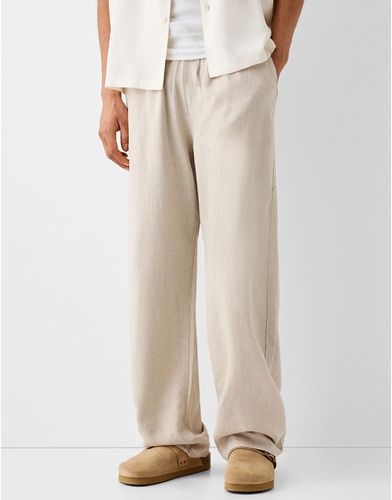 Pantaloni con fondo ampio in lino color sabbia - Bershka - Modalova