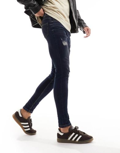 DTT - Jeans skinny elasticizzati invecchiati blu scuro con strappi - Don't Think Twice - Modalova