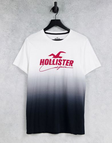 T-shirt con logo frontale e stampa sfumata da bianca a nera - Hollister - Modalova