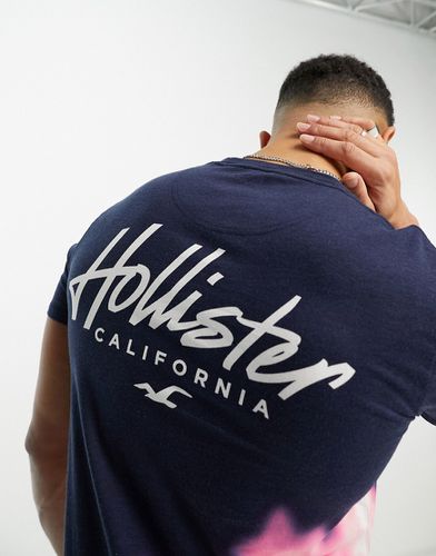 T-shirt taglio lungo blu sfumato lavaggio acido con logo sul petto e sul retro - Hollister - Modalova