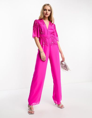 Tuta jumpsuit acceso con scollo profondo decorato - Hope & Ivy - Modalova