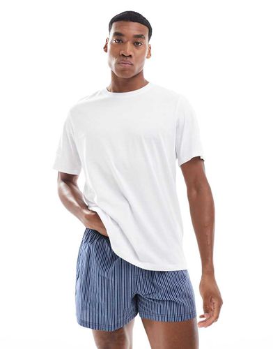 Pigiama con pantaloncini a quadri e T-shirt bianca a righe - Jack & Jones - Modalova