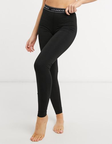 Leggings da casa neri con elastico con logo - Loungeable - Modalova