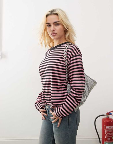 Top a maniche lunghe rosa e nero a righe - Monki - Modalova