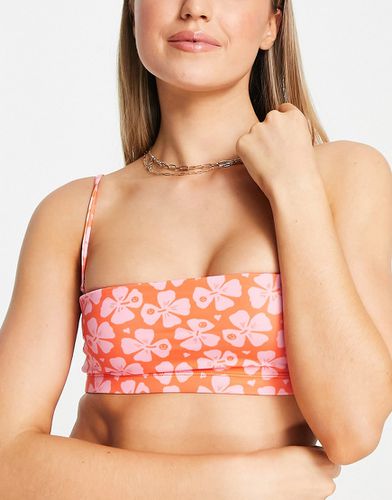 Top bikini a fascia con fiori hawaiani rosa - Monki - Modalova