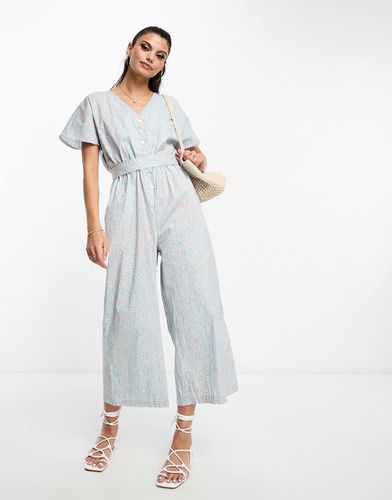 Tuta jumpsuit a maniche corte a pois con scollo a V e allacciatura in vita - Monki - Modalova