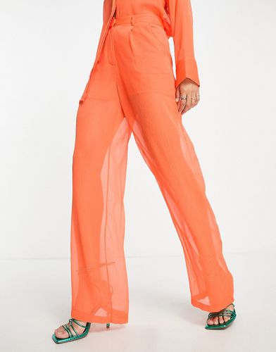 Pantaloni con fondo ampio arancioni trasparenti in coordinato - NA-KD - Modalova