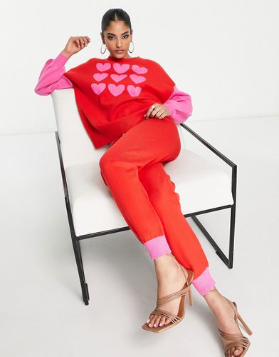 Pantaloni in maglia rosa e rosso a contrasto in coordinato - Never Fully Dressed - Modalova